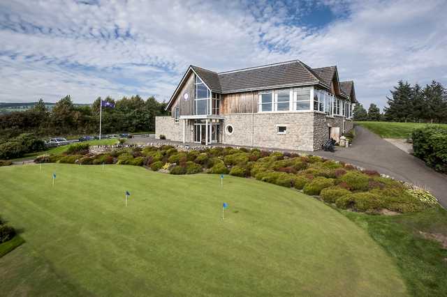 A view of the practice putting green and clubhouse at Alyth Golf Club