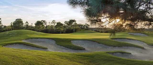 A view of a green protected by undulating bunkers at The Beaufort Club