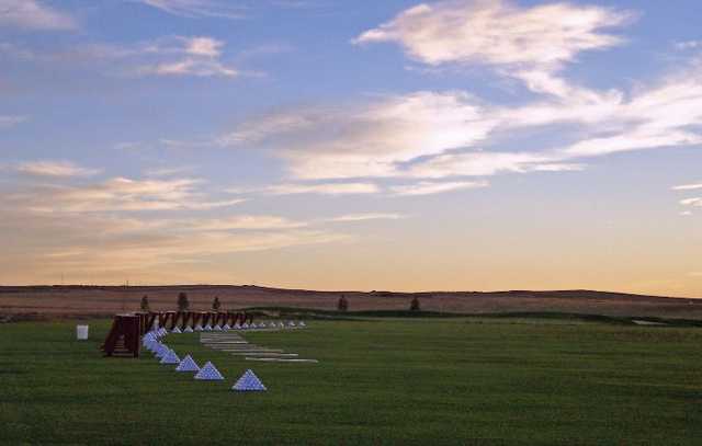A sunrise view of the driving range at Antler Creek Golf Course