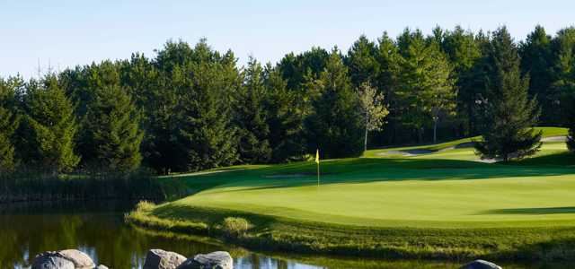 A view of a hole surrounded by water at Royal Ashburn Golf Club