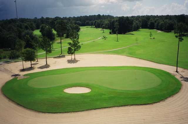 A view of green #5 surrounded by sand at Wildwood Country Club