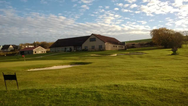 A view of a green and the clubhouse at Bridgend Golf Club