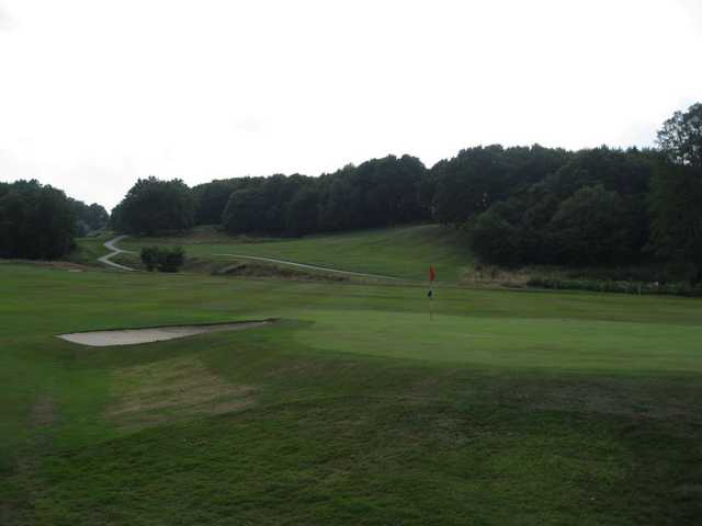 A view of the 18th green and greenside bunker at Greenway Hall Golf Club