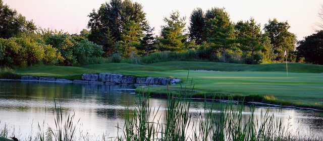 A view of a green with water coming into play at Huron Oaks Golf Course