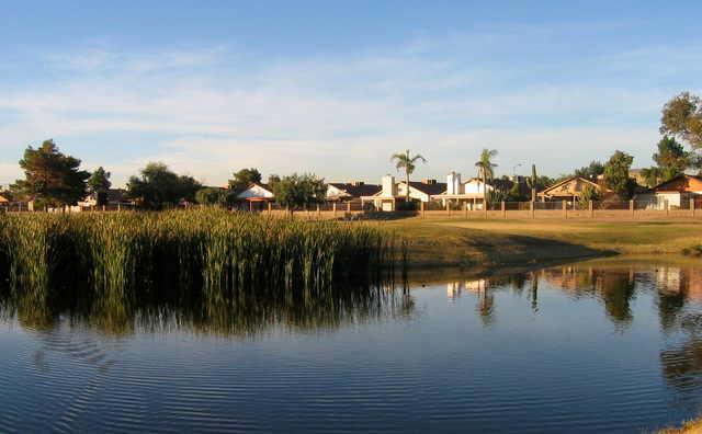 View of a green over water at Peoria Pines Golf Club