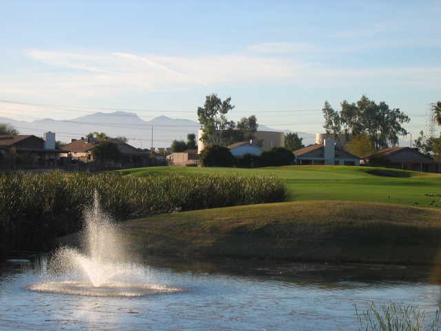 View of a green over water at Peoria Pines Golf Club