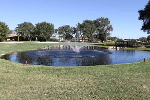 A view of the clubhouse and a green at Citrus Hills Golf & Country Club