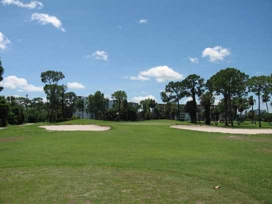 A view of green #13 protected by bunkers at Poinciana Country Club
