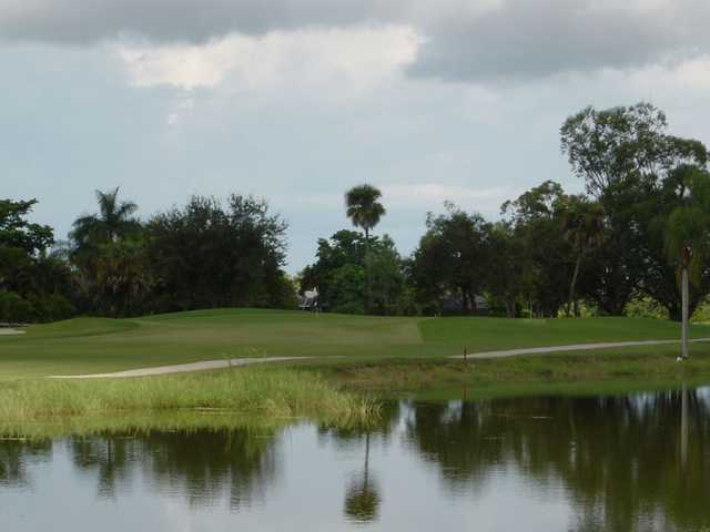 A view over the water of green #8 at Hibiscus Golf Club