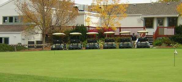 A view of the clubhouse and putting green at The Knolls Golf Club