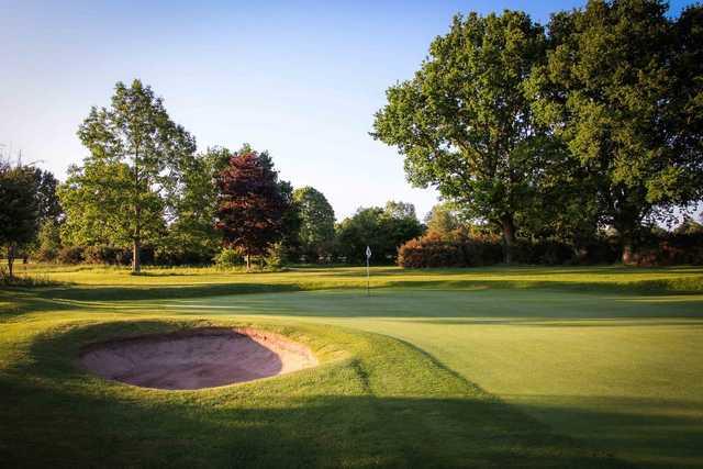 View of a green and bunker at Henley Golf Club