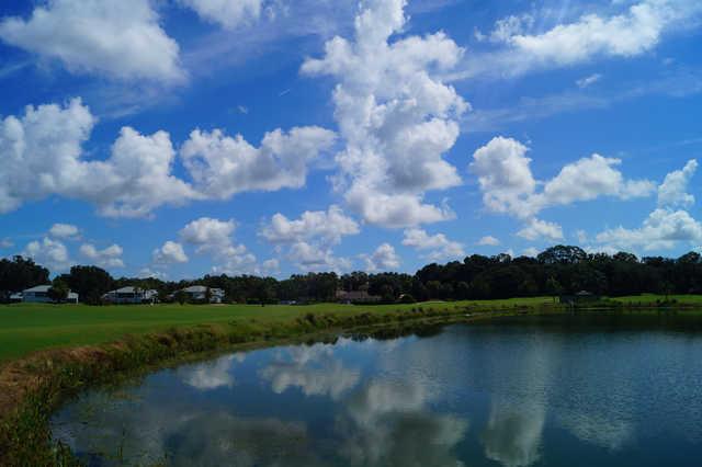 View of the clubhouse over the lake at White Heron Golf Club