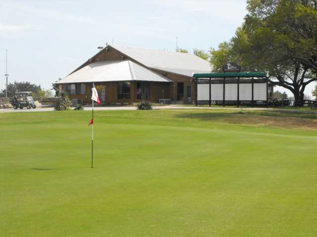 A view of the 18th green with clubhouse in background at Delaware Springs Golf Course