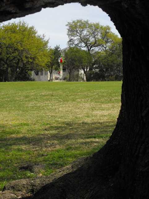 A view of green # framed by tree at Delaware Springs Golf Course