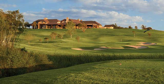 A view of the 1st green with clubhouse in background at Wildhorse Golf Club of Robson Ranch