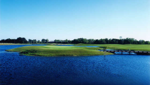 A view of the 12th green surrounded by water at Lakes Course from Wildcat Golf Club