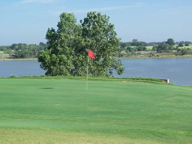 A view of a hole with water in background at P.A.R. Country Club.