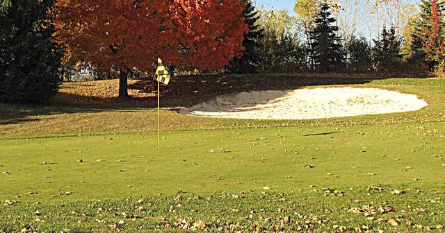 A fall day view of a hole at Maples Golf Club.