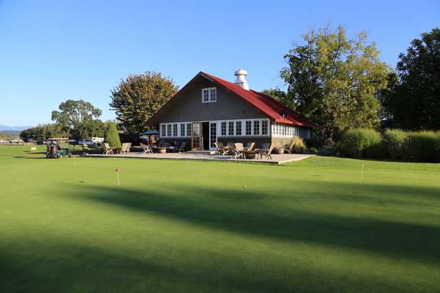 View of the putting green and clubhouse at Eagle Creek Golf Course 