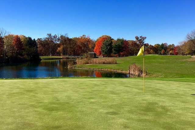 A fall day view of a hole with water in background at Eastwood Golf Course.