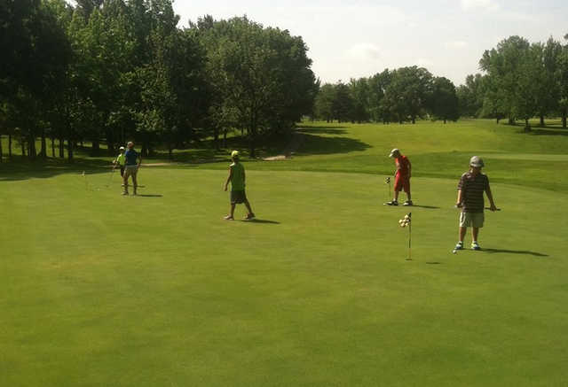 A view of the practice putting green and a fairway in the distance at Rend Lake Golf Course.