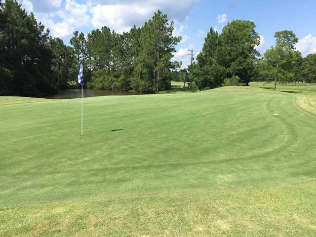 A sunny day view of a hole at Royal Golf Club.