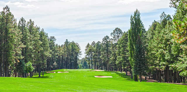 A view of a hole flanked by bunkers at Pinetop Country Club.