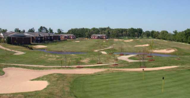 A sunny day view from the practice putting green from The Links at Rainbow Curve Golf & Country Club (Lindseymanagement).