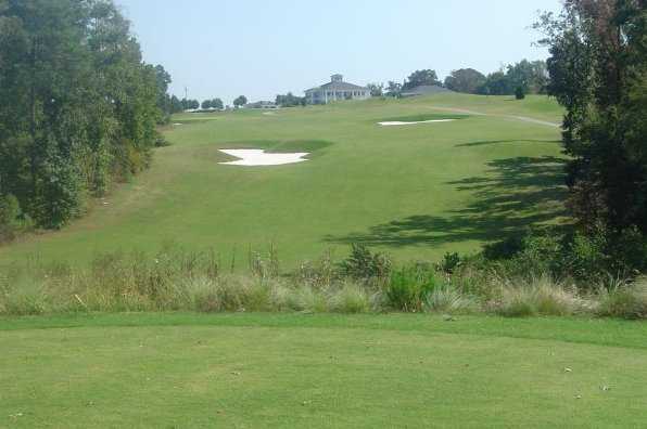 A view of the 18th hole with clubhouse in background at River Ridge Golf Club