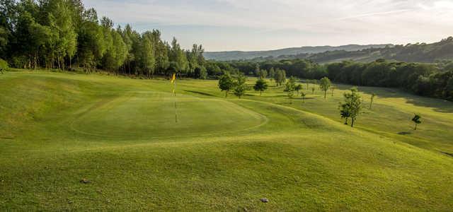 A sunny day view of a hole at Glynhir Golf Club.