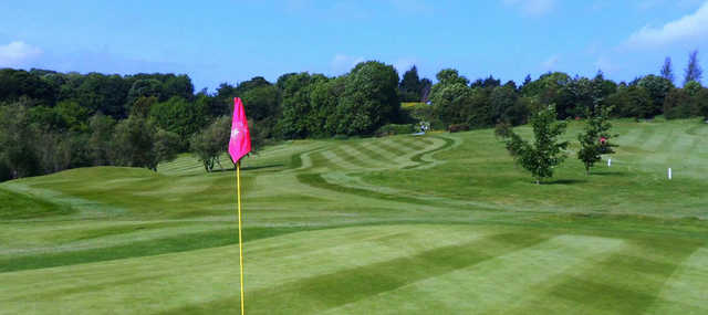 A sunny day view from a green at Mold Golf Club.