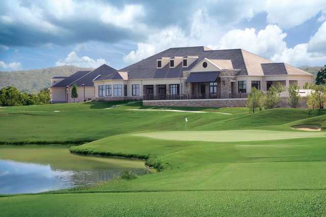 A view of a green and the clubhouse at WinStar Golf Course.