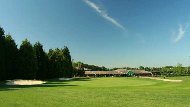 A view of a hole and the clubhouse at Hoebridge Golf Centre.