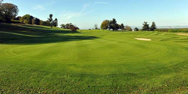 A sunny day view of a green from The Murrayshall Course at Murrayshall Golf Club.