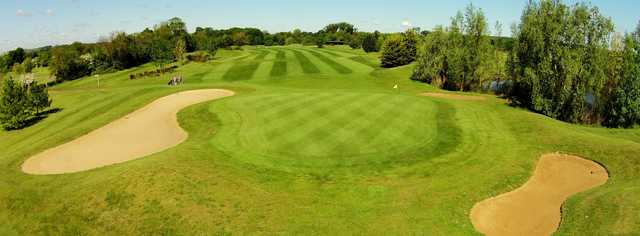 A view of a hole flanked by bunkers at Cambridge Meridian Golf Club.