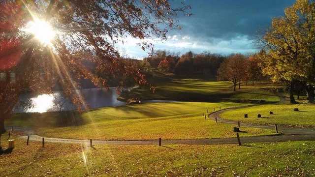 A sunny day view of a green at Duck Hollow Golf Club.