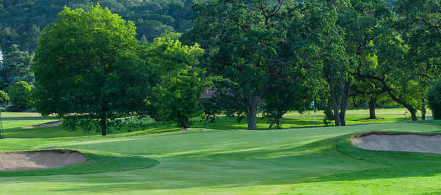 A view of a green flanked by bunkers at Sugarloaf Golf Club.