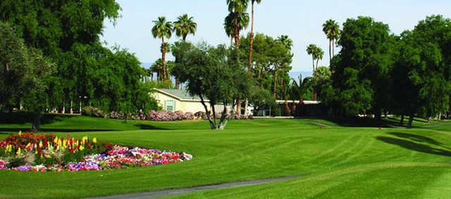 A sunny day view of the red tee at Date Palm Country Club.