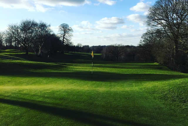A sunny day view of a hole at Hartford Golf Club.