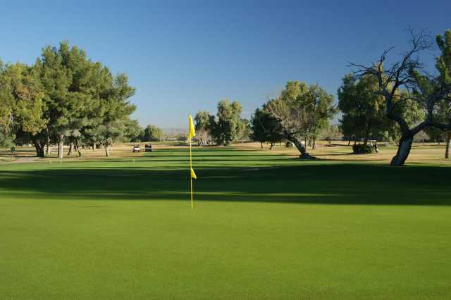 A sunny day view of a hole at El Rio Golf Course.