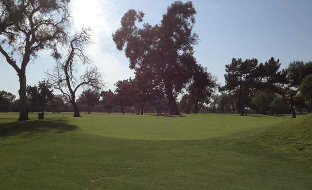 A sunny day view of a green at Willowick Golf Course.