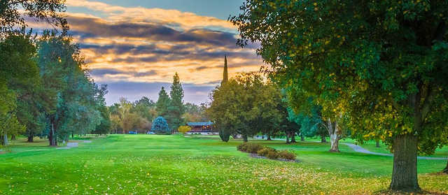 A splendid fall day view of a fairway at Ancil Hoffman Golf Course.