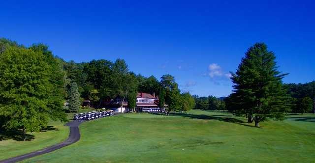 A view of the clubhouse and putting green at Woodstock Country Club