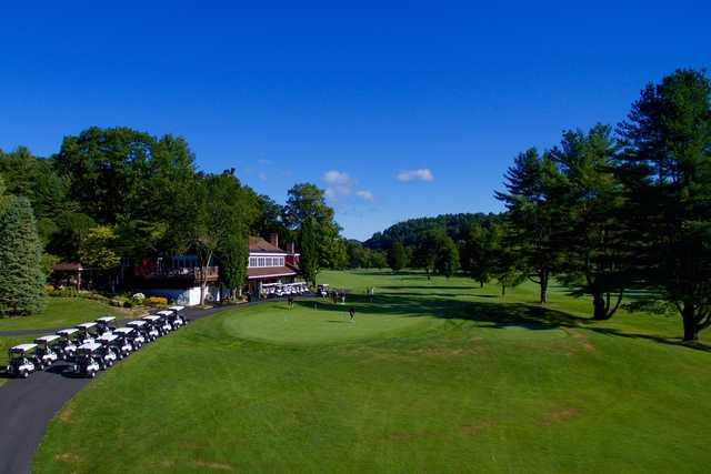 A view of the clubhouse and putting green at Woodstock Country Club