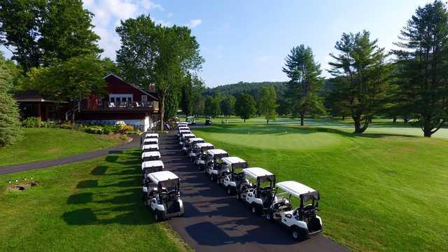 A view of the clubhouse and putting green at Woodstock Country Club