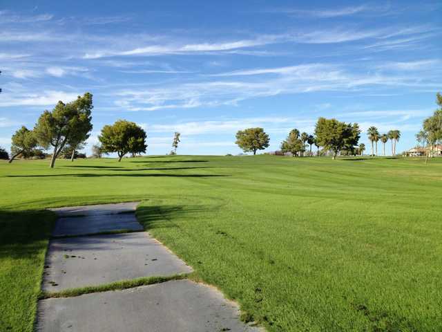 A sunny day view of a fairway at Blythe Golf Course.