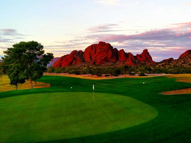 A view of a green and mountains in the distance at Papago Golf Course.
