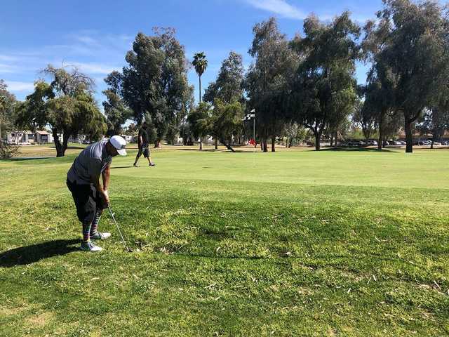 A sunny day view of a hole at Glen Lakes Golf Course.