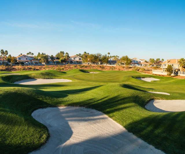 A sunny day view of a hole at Legacy Golf Club.