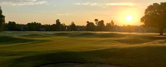 A sunset view of a hole at English Turn Golf & Country Club.